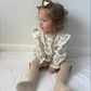 Flora Romper £13.90  (Available from size 0-3 m)
